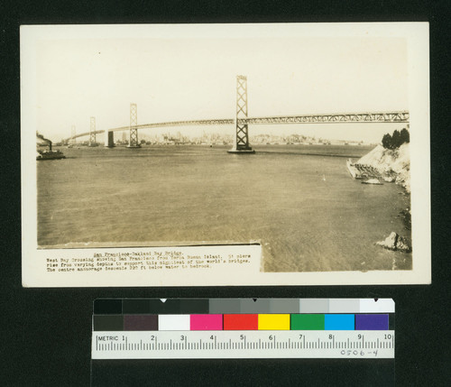 San Francisco-Oakland Bay Bridge. West Bay Crossing showing San Francisco from Yerba Buena Island. 51 piers rise from varying depths to support this mightiest of the world's bridges. The centre anchorage descends 220 ft below water to bedrock