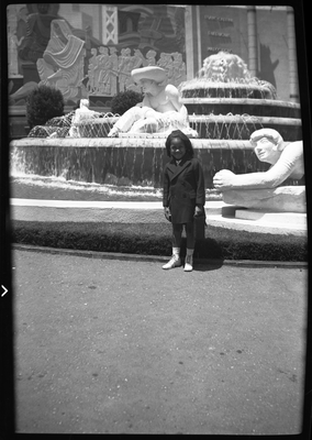 Girl standing next to Fountain of Western Waters at the Golden Gate International Exposition