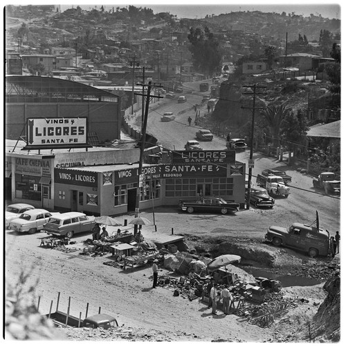 Vendors of used goods and one of many liquor stores