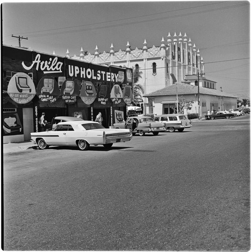 Ávila Upholstery shop on 8th Street and Avenida Revolución with the Jai Alai Palace in the background