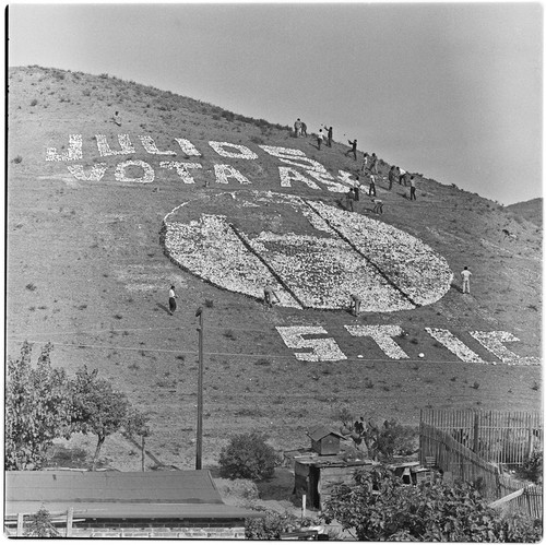 Political propaganda being placed on a Tijuana hillside