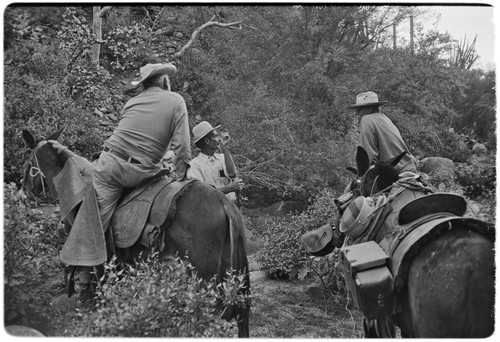 Tacho Arce, left, exchanging gossip with rancher at Rancho San Nicolás