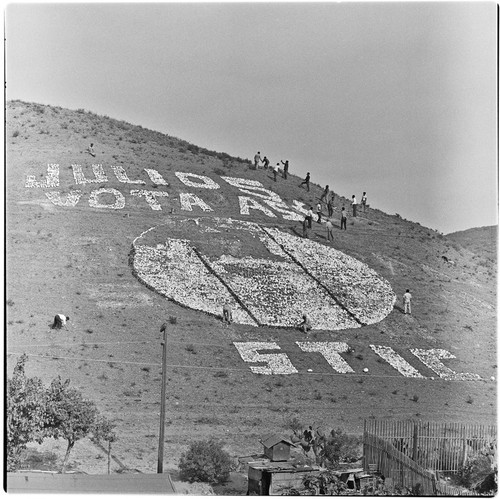 Political propaganda being placed on a Tijuana hillside