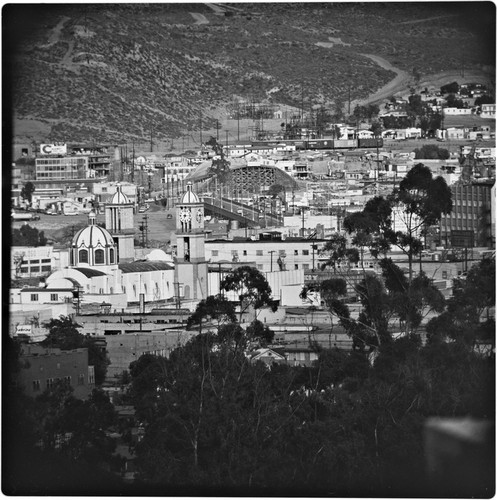 Guadalupe Cathedral in the foreground, with Puente México and Puerta de México (under construction) in the center