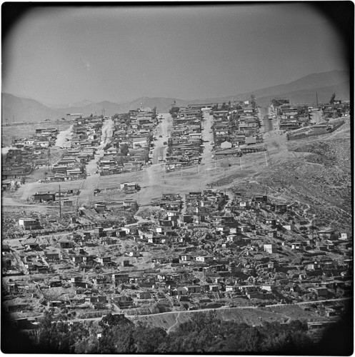 Hillside on the east side of the Tijuana River Valley. Subdevelopment at the top of the photograph, on the edge of Mesa de Otay. Below are irregular settlements