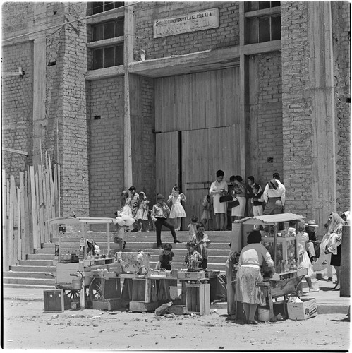 Street vendors at the corner of the Divina Providencia Church in Colonia Libertad