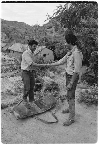 Francisco Arce, left, and Enrique Hambleton shaking hands at Rancho San Gregorio