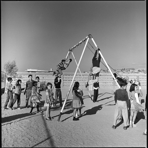 Children playing outside at Alessio School Number 4, Colonia Postal