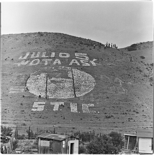 Political propaganda being placed on a Tijuana hillside