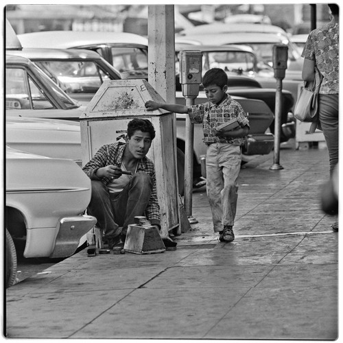 Shoe shine boy and "chicklets" gum salesman