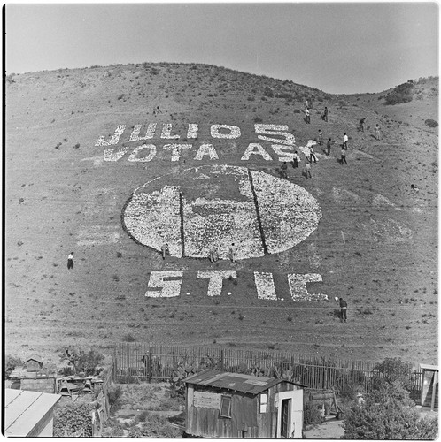 Political propaganda being placed on a Tijuana hillside