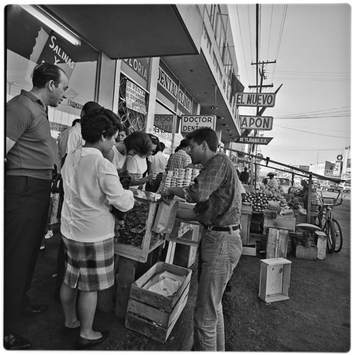 Busy street vendor with customers