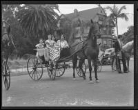 Carriage riders in historic dress at the Old Spanish Days Fiesta parade, Santa Barbara, 1935