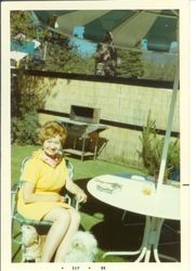 Bunni Cornelia Myers Streckfus Cogsdell seated at patio table outside at Tahoe in September 1969
