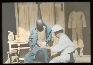 Brother John Dorsey, MM, tending to a patient, China, ca. 1918-1938