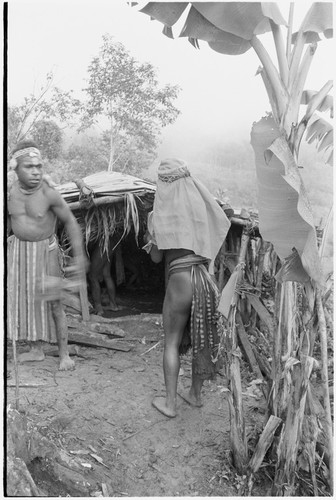 Bride price ritual: man with woman wearing large shell valuables