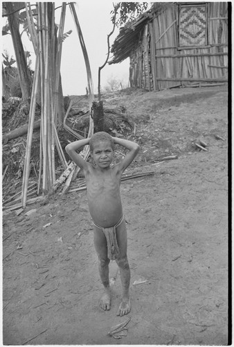 Child in front of Rappaport's house in Tsembaga