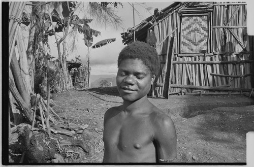 Adolescent boy in front of the Rappaports' house