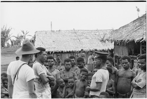 Wanumbil, Wanuma Census Division: Pete Vayda and man in police-style cap, crowd