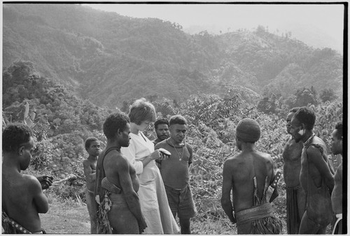 Kwima: Ann Rappaport and young men talking