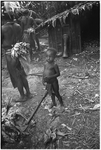 Pig festival, pig sacrifice, Tsembaga: child next to shelter behind ritual fence