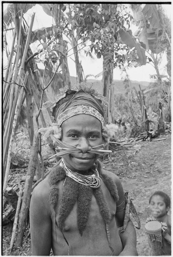 Pig festival, singsing preparations, Tsembaga: boy wears marsupial fur ornaments and other finery