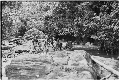 Yagip River: people wading across