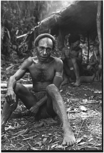 Pig festival, pig sacrifice, Tsembaga: men at ancestral shrine