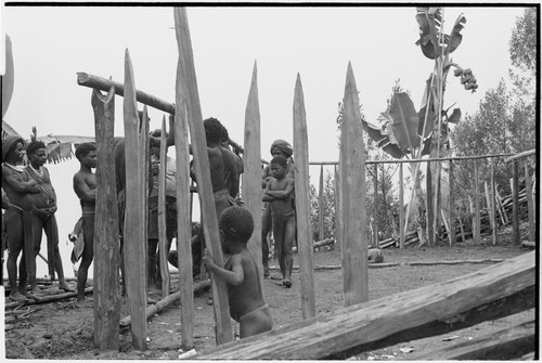 House-building for Rappaports: sharpened stakes on perimeter for frame, rectangular shape marked with poles