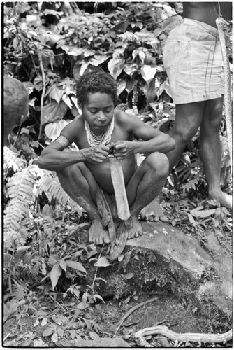 Boy stretches piece of snake skin