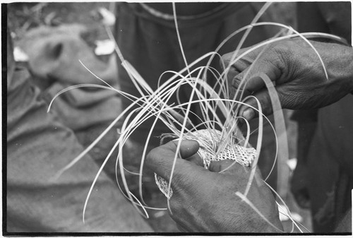 Weaving: an armband is intricately woven from orchid fibers