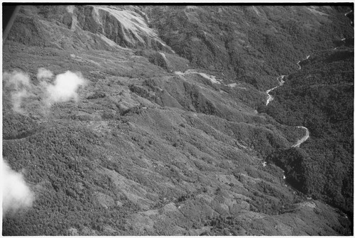 Aerial view of mountains, river, trails and garden clearings