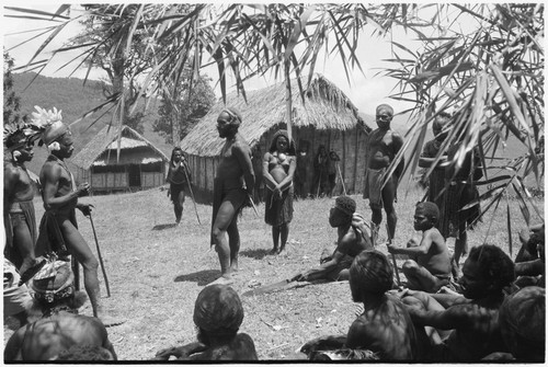 Dispute in Tuguma: disagreement between Mbi (right) over Krp's (left) shooting of pig