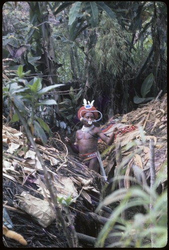 Pig festival, wig ritual: Akis with red wig (mamp gunc) for dedication to red spirits