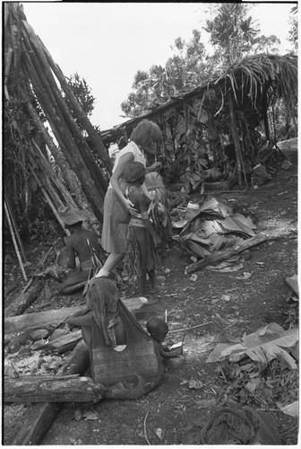 Pig festival, pig sacrifice, Tsembaga: Ann Rappaport with woman at ancestral shrine