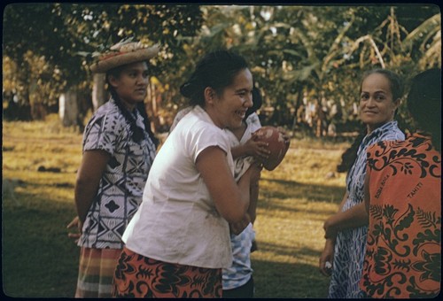 Local women at archaeology exhibit, Moorea