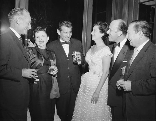 Photograph of Leonard Bernstein, Judy Garland and Merle Oberon