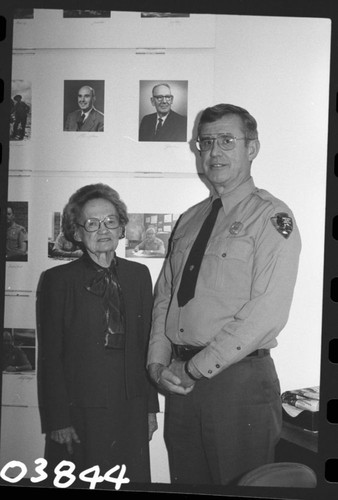 Park Superintendents, NPS Individuals. Irma Buccholz, Secretary to the Superintendent and Supt. John H. Davis posed under photographer of his father, former Supt. John M. Davis. Irma Buccholz was sec