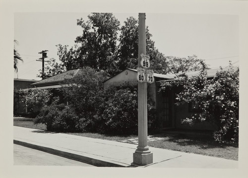 6th Street in Beaumont, showing road signs of US Rt. 99, Rt. 60 and Rt. 70