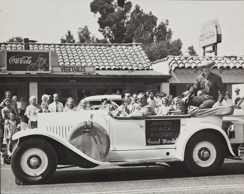 The 1947 Cherry Festival with Johnny Mack Brown as Grand Marshall of the Parade, and Jimmy James in the front passenger seat