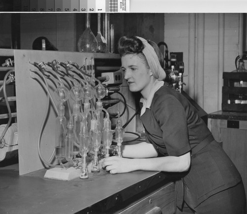 [Photograph of a female factory worker]