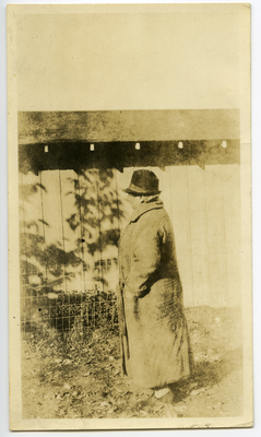 Lucy Hinds standing in front of farm building