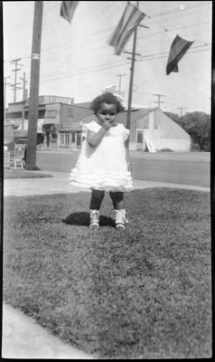 Gloria Pearl Roberts in front yard