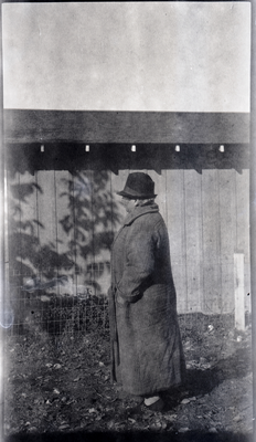 Lucy Hinds standing next to farm building