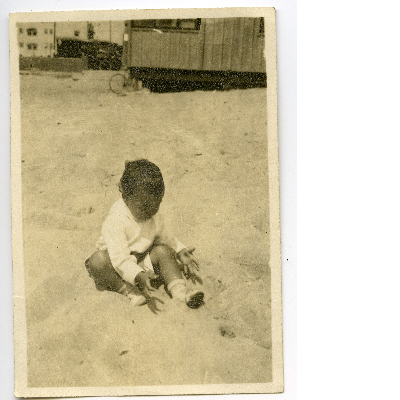 Billy Lane playing in sand at the beach