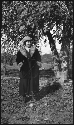 Pearl Roberts standing in front of fence on farm