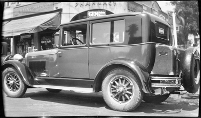 Automobile with Hoover bumper sticker on back window