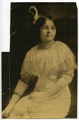 Portrait of Pearl Roberts seated wearing white dress and gloves