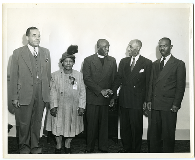 Frederick Roberts shaking hands with minister