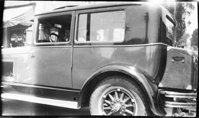 Gloria Pearl Roberts sitting in automobile